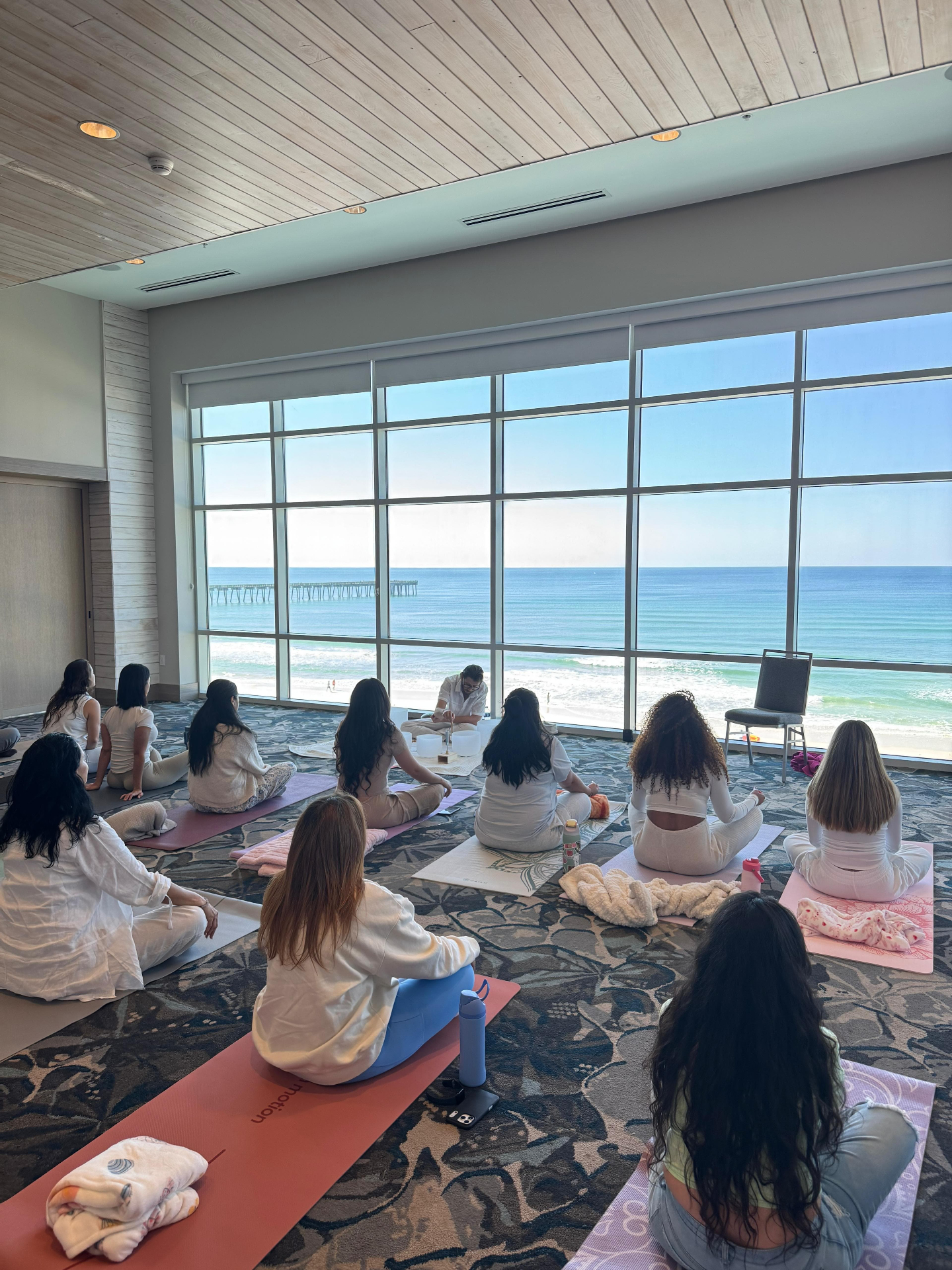 Group sound bath ceremony with an ocean view on the Emerald Coast