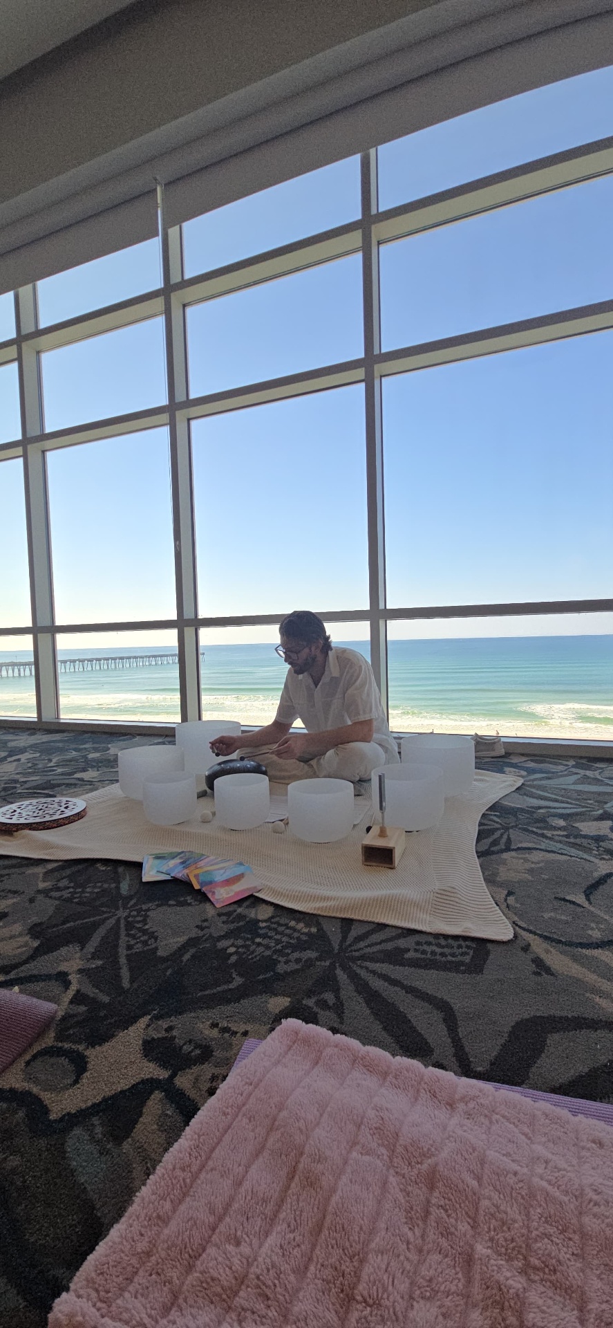 Keifer preparing crystal singing bowls before a private session